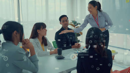 Business people in corporate staff meeting with envisional graphic . Concept of digital technology for marketing data analysis and investment decision making .の写真素材