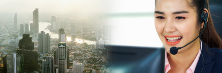 Business people wearing headset working in office in widen view to support remote customer or colleague. Call center, telemarketing, customer support agent provide service on telephone video call.の写真素材