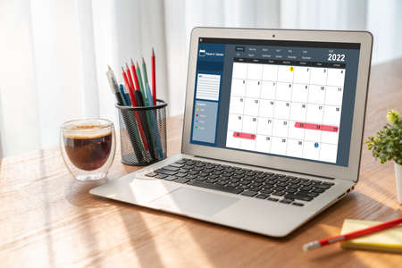 Calendar on computer software application for modish schedule planning for personal organizer and online businessの写真素材