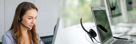 Business people wearing headset working in office in widen view to support remote customer or colleague. Call center, telemarketing, customer support agent provide service on telephone video call.の写真素材