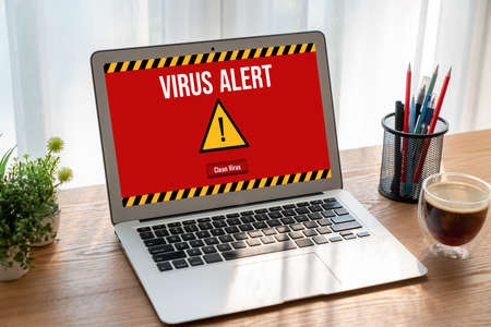 Virus warning alert on computer screen detected modish cyber threat , hacker, computer virus and malwareの写真素材
