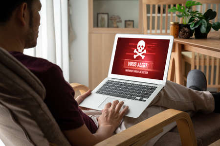 Virus warning alert on computer screen detected modish cyber threat , hacker, computer virus and malwareの写真素材