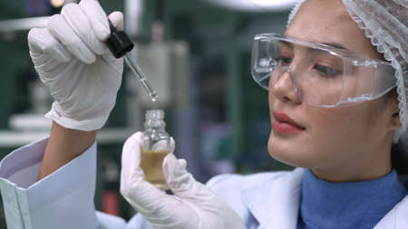 Scientist test CBD hemp oil product in curative CBD lab . The hemp oil contain natural cbd extraction from organic hemp in the farm .の写真素材