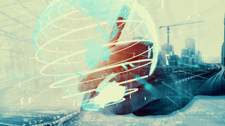 Future building construction and inventive engineering project concept with HUD hologram graphic design. Building engineer, architect people or construction worker works with modern civil technology.の写真素材