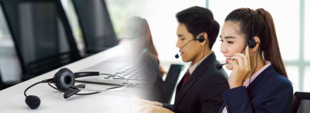 Business people wearing headset working in office in widen view to support remote customer or...
