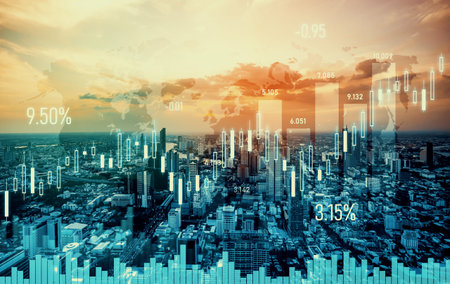 As background for a financial or business concept, digital screen and financial graphs overlap on a...