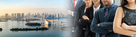 Successful business people standing together widen out showing strong relationship of worker community. A team of businessman and businesswoman expressing a strong group teamwork at the modern office.の写真素材