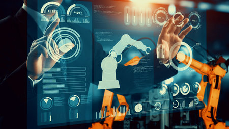 Engineer use cybernated robotic software to control industry robot arm in factory . Automation...