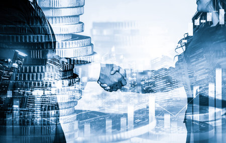Business handshake on finance prosperity and money technology asset background . Economy and financial growth by investment in valuable stock market to gain wealth profit form currency tradingの写真素材