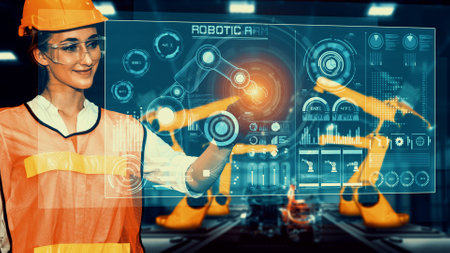 Engineer use cybernated robotic software to control industry robot arm in factory . Automation manufacturing process controlled by specialist using IOT software connected to internet network .の写真素材
