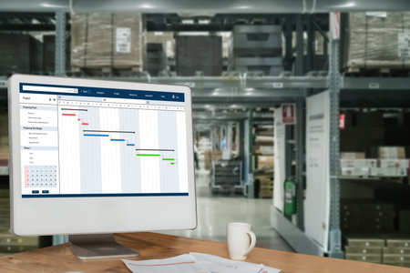 Project planning software for modish business project management on the computer screen showing timeline chart of the team projectの写真素材