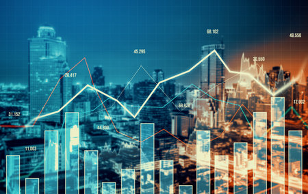 As background for a financial or business concept, digital screen and financial graphs overlap on a picture of modernistic cityscape, skyscrabbers.の写真素材