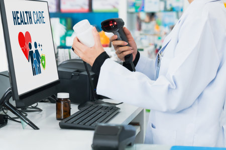 Closeup young pharmacist scanning the barcode of a mockup qualified pharmaceutical, medicine pill container or bottle for copyspace at pharmacy.の写真素材