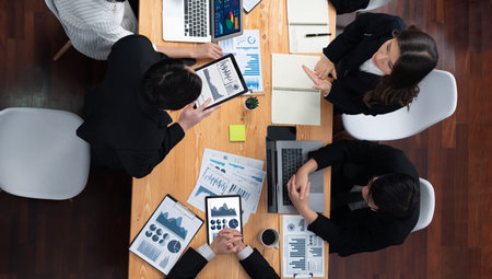 Top-view business team of financial data analysis meeting with business intelligence, report paper...