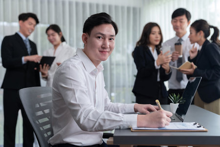 Portrait of focus young successful confident male manager, executive wearing business wear in...