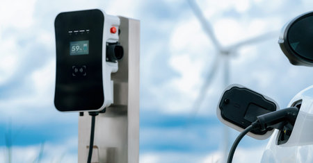 Progressive combination of wind turbine and EV car, future energy infrastructure. Electric vehicle...