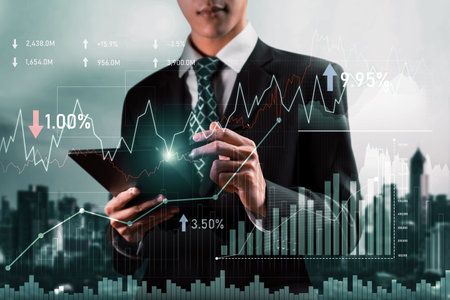 Businessman analyst working with digital finance business data graph showing technology of investment strategy for perceptive financial business decision. Digital economic analysis technology concept.の写真素材
