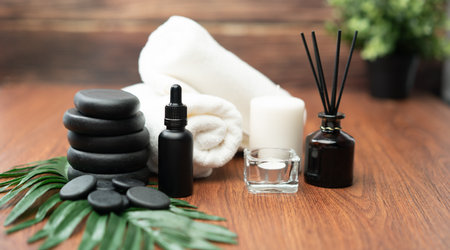 Spa accessory composition set in day spa hotel , beauty wellness center . Spa product are placed in luxury spa resort room , ready for massage therapy from professional service .の写真素材