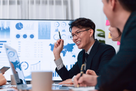 Business team of financial data analysis meeting with business intelligence, report paper and dashboard on laptop for marketing strategy. Business people working together to promote harmony in office.の写真素材