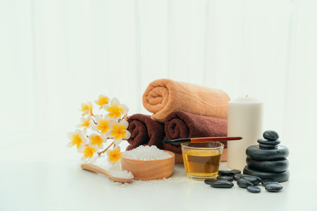 Spa accessory composition set in day spa hotel , beauty wellness center . Spa product are placed in luxury spa resort room , ready for massage therapy from professional service .の写真素材