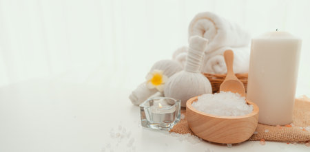 Spa accessory composition set in day spa hotel , beauty wellness center . Spa product are placed in luxury spa resort room , ready for massage therapy from professional service .の写真素材