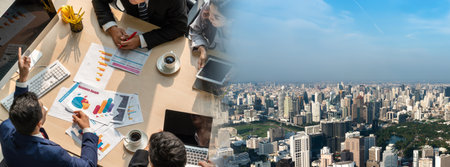 Business people group meeting shot from top widen view in office . Profession businesswomen, businessmen and office workers working in team conference with project planning document on meeting table .の写真素材
