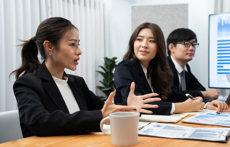 Business team of financial data analysis meeting with business intelligence, report paper and dashboard on laptop for marketing strategy. Business people working together to promote harmony in office.の写真素材