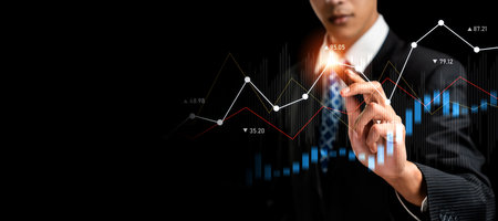 Businessman analyst working with digital finance business data graph showing technology of investment strategy for perceptive financial business decision. Digital economic analysis technology concept.の写真素材