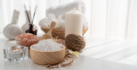 Spa accessory composition set in day spa hotel , beauty wellness center . Spa product are placed in luxury spa resort room , ready for massage therapy from professional service .の写真素材