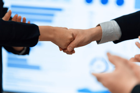 Closeup office worker shake hand business team leader manager for strong teamwork in office to...