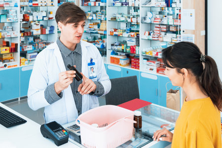 Professional pharmacist advise or explain property of qualified medical product to customer in pharmacy, druggist answer to client healthcare inquiry, medical service and consultation concept.の写真素材