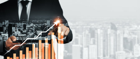 Businessman analyst working with digital finance business data graph showing technology of investment strategy for perceptive financial business decision. Digital economic analysis technology concept.の写真素材