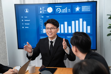 Business team of financial data analysis meeting with business intelligence, report paper and dashboard on laptop for marketing strategy. Business people working together to promote harmony in office.の写真素材