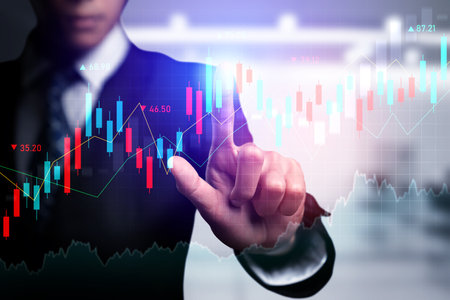 Businessman analyst working with digital finance business data graph showing technology of investment strategy for perceptive financial business decision. Digital economic analysis technology concept.の写真素材