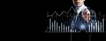 Businessman analyst working with digital finance business data graph showing technology of investment strategy for perceptive financial business decision. Digital economic analysis technology concept.の写真素材
