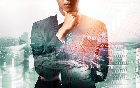 Businessman analyst working with digital finance business data graph showing technology of investment strategy for perceptive financial business decision. Digital economic analysis technology concept.の写真素材