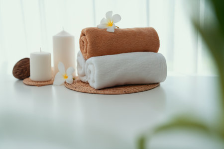 Spa accessory composition set in day spa hotel , beauty wellness center . Spa product are placed in luxury spa resort room , ready for massage therapy from professional service .の写真素材
