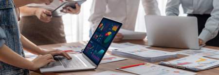 Panorama shot analyst team utilizing BI Fintech to analyze financial report with laptop....