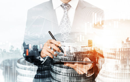Businessman analyst working with digital finance business data graph showing technology of investment strategy for perceptive financial business decision. Digital economic analysis technology concept.の写真素材