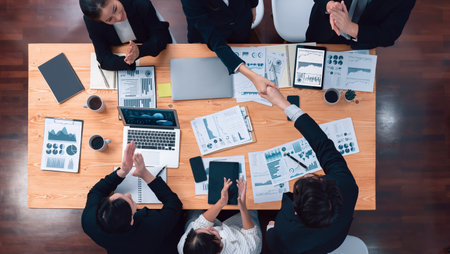Top-view business team of financial data analysis meeting with business intelligence, report paper...