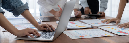 Panorama shot analyst team utilizing BI Fintech to analyze financial report with laptop....