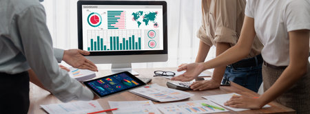Panorama shot analyst team utilizing BI Fintech to analyze financial report with laptop....