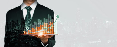 Businessman analyst working with digital finance business data graph showing technology of investment strategy for perceptive financial business decision. Digital economic analysis technology concept.の写真素材