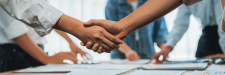 Analyst team celebrates successful data analysis with handshake. Panorama shot handshaking after...