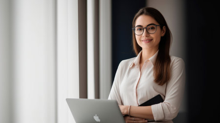 Ambitious and positive businesswoman, smiling face, holding laptop, standing in office. Generative AI AIG20.の素材