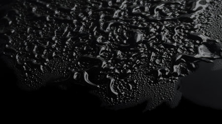 Black background with water drop texture. Generative AI AIG21.の素材