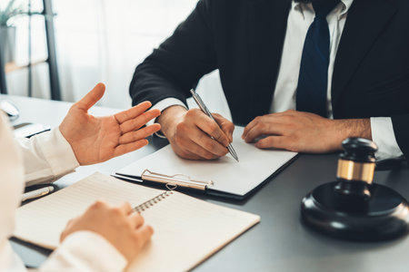 Lawyer signing contract, professional lawyer in law firm office drafting legal document or contract agreement ensuring lawful protection for clients disputes as fairness advocate concept. Equilibriumの写真素材