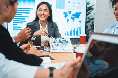 Multiracial analyst team use BI dashboard data to analyze financial report on meeting table. Group...