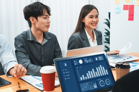 Multiracial analyst team use BI Fintech software to analyze financial data on meeting table....