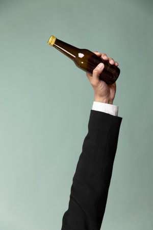 Eco business recycle waste policy, holding glass bottle trash on isolated background. Corporate responsibility for green environment and community. Reuse, reduce and recycle for sustainability. Alterの写真素材